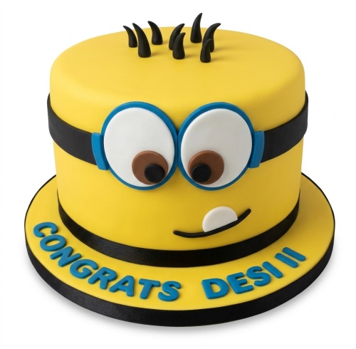 Round yellow Minion theme birthday cake with goggles, eyes, and black hair, with a custom message on the board.