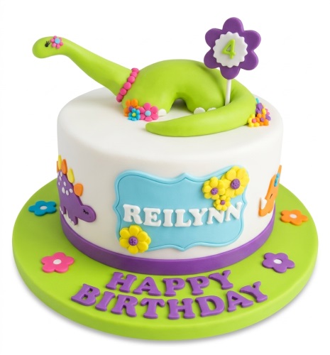 White round cake with 3D green dinosaur, colourful flowers, and custom age topper