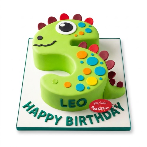 Number 3 shaped green dinosaur birthday cake with colourful spots and custom name.