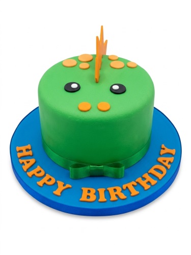 Round green dinosaur face birthday cake with orange spikes and spots, on a blue board with 'Happy Birthday' message.