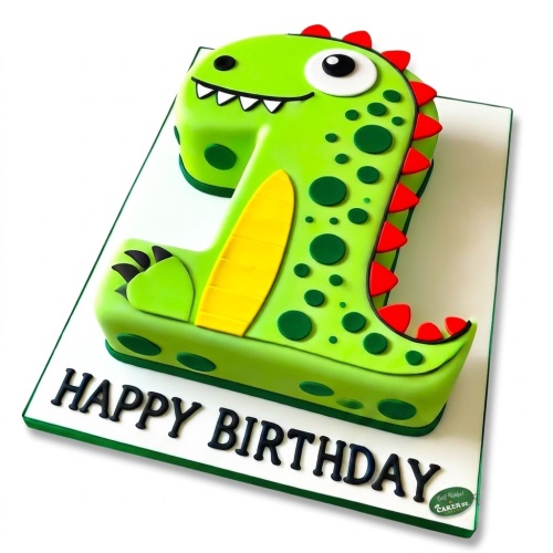 Green dinosaur shaped number 1 cake with 'Happy Birthday' message.