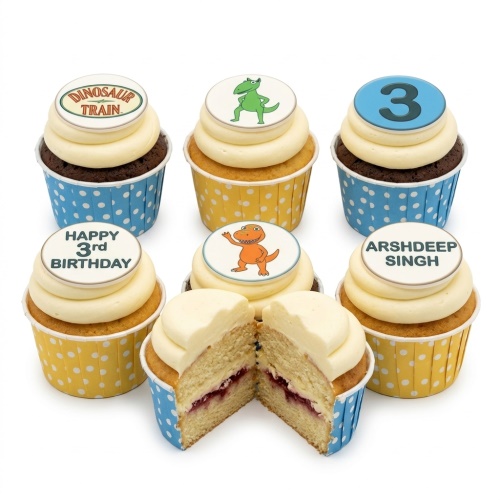 Dinosaur themed birthday cupcakes with cartoon dinosaur and "Dinosaur Train" toppers