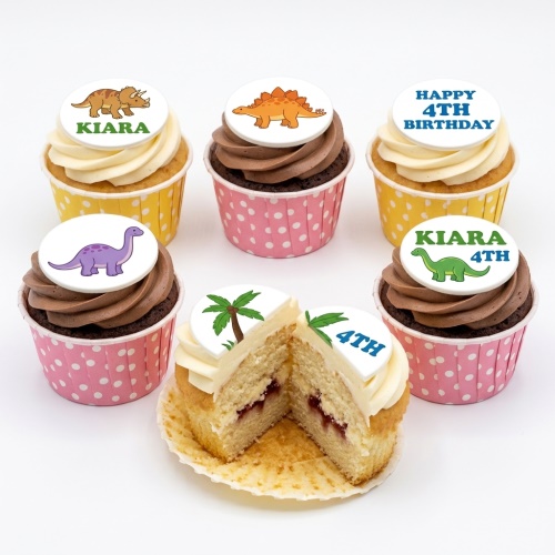 Assortment of dinosaur and palm tree themed cupcakes with custom age toppers.