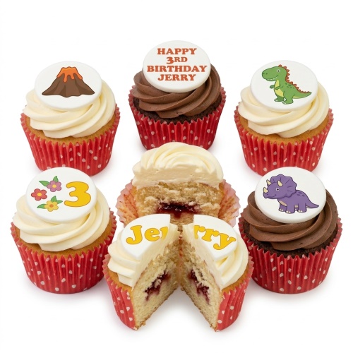 Dinosaur and volcano themed cupcakes with white and chocolate frosting, featuring a custom age topper.