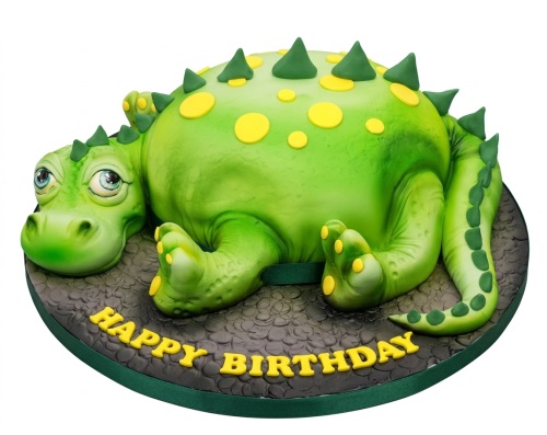 Green 3D dinosaur birthday cake with yellow spots and spikes, lying on a textured base.