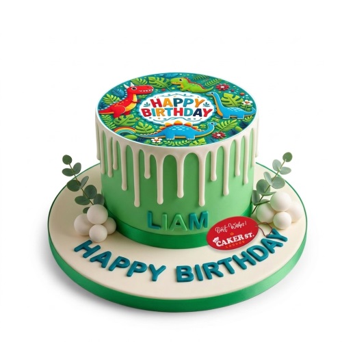 Green dinosaur birthday cake with white drip and personalised name.