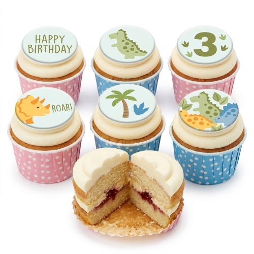 Six dinosaur-themed birthday cupcakes with white frosting and polka dot cases, including a custom age topper.