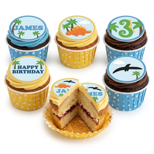 Assortment of dinosaur and jungle themed birthday cupcakes with custom age and name toppers.