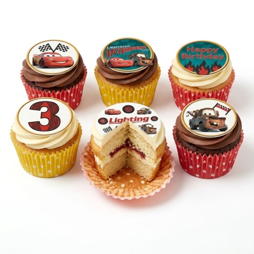 Set of Disney Cars themed cupcakes with Lightning McQueen and Mater toppers, racing flags, a 'Happy Birthday' message, and a number 3 topper.