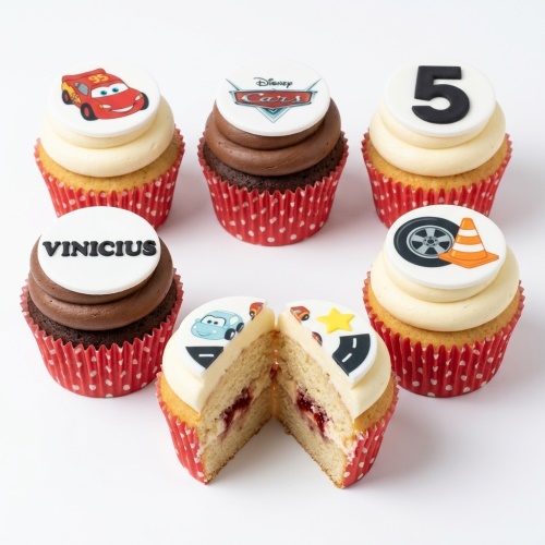 Disney Cars themed cupcakes with Lightning McQueen, logo, racing wheel, and custom age toppers.