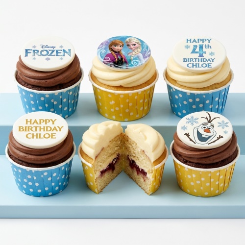 Disney Frozen themed cupcakes with Elsa, Anna, and Olaf toppers, on chocolate and vanilla frosting.