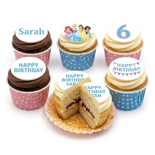 Assortment of princess themed birthday cupcakes with custom age and name toppers.