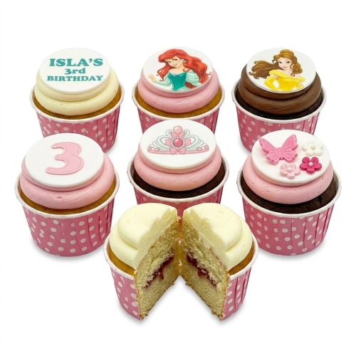 A set of Disney Princess themed birthday cupcakes with Ariel, Belle, a tiara, butterfly, and custom age topper.
