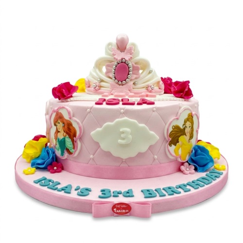 Pink Disney Princess birthday cake with tiara, Ariel and Belle characters, and custom age plaque.