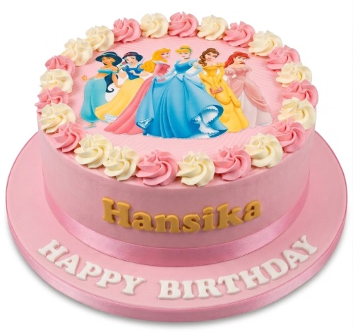 Round pink Disney Princess birthday cake with buttercream swirls and custom name.