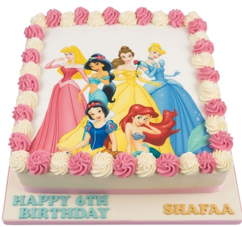 Square white birthday cake with an edible image of six Disney Princesses, bordered with pink and white piped frosting, with a custom message area.