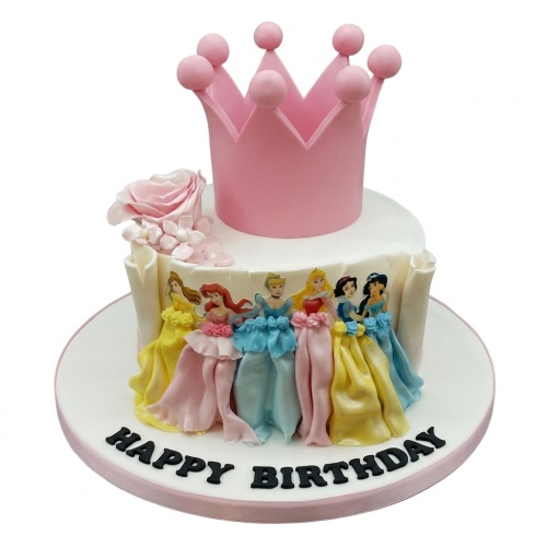 Round white princess birthday cake with edible princess figures, pink crown topper, and 'Happy Birthday' message.
