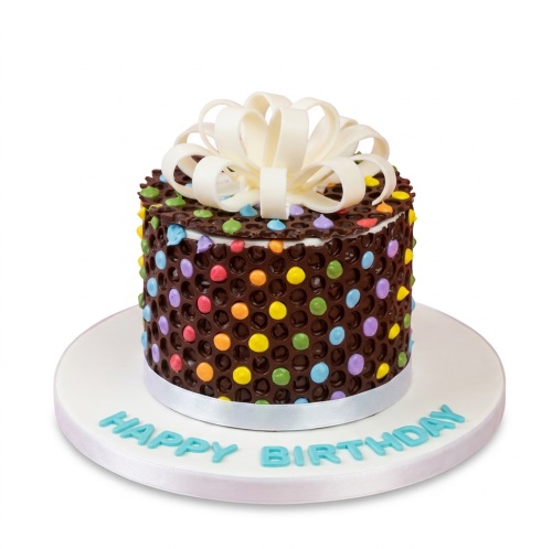 Round chocolate birthday cake with multicoloured polka dots and a white bow, on a white board with "Happy Birthday".
