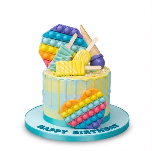 Single-tier Pop It fidget toy birthday cake with rainbow colours and ice cream decorations.