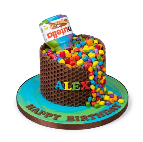 Round chocolate honeycomb cake with a Nutella jar pouring colourful candies, on a blue and green board with a personalised name.