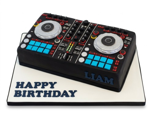 Black DJ mixer birthday cake with silver, red, yellow, and blue details on a white board.