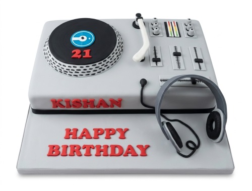 Grey DJ deck birthday cake with black turntable, mixer, headphones, red custom age 21, and personalised name.