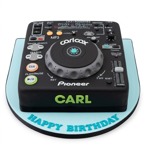 Black DJ deck birthday cake with grey, orange, and green details, on a light blue board with a "Happy Birthday" message.