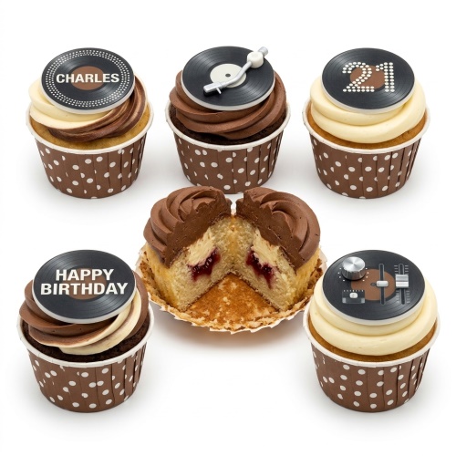 Cupcakes with black record player, mixer, and vinyl record toppers, brown and cream frosting, polka dot wrappers.