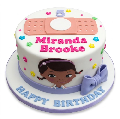 White round Doc McStuffins birthday cake with a band-aid, colourful flowers, purple ribbon, and custom age topper.