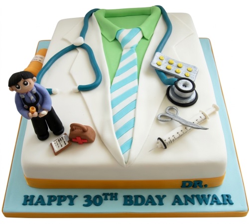 Rectangular birthday cake decorated as a doctor's coat with stethoscope, medical tools, and a custom age message.