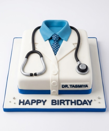 White doctor's coat cake with blue shirt, polka dot tie, and stethoscope on a white and blue board with 'Happy Birthday' message.
