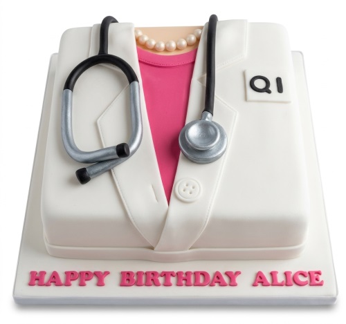 White lab coat cake with pink shirt, pearl necklace, and stethoscope. Personalised birthday message.