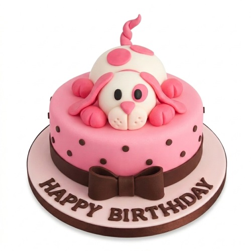Pink round birthday cake with a 3D white and pink puppy on top, brown polka dots, a brown ribbon and bow, and 'Happy Birthday' written on the board.