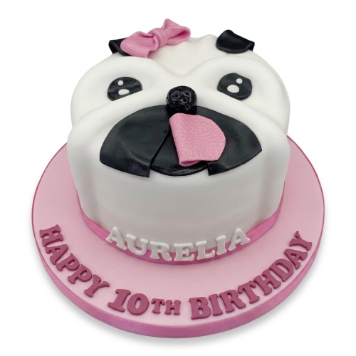 White pug dog face birthday cake with pink bow and pink board.