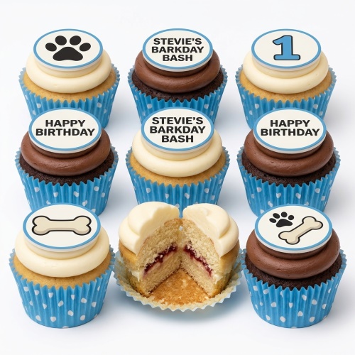 Dog themed cupcakes with paw print, bone, and custom message toppers in blue polka dot wrappers.