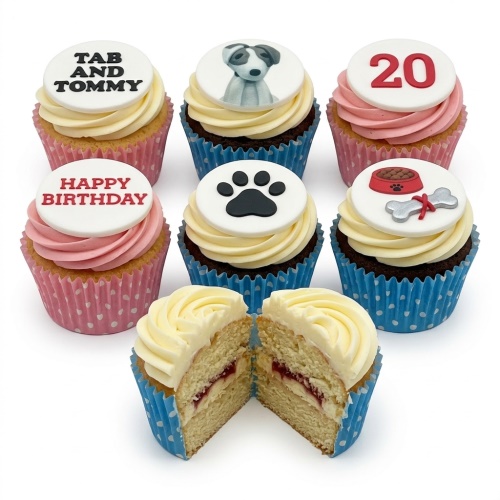 Assortment of dog theme birthday cupcakes with paw print, dog, dog bowl, and custom age toppers.