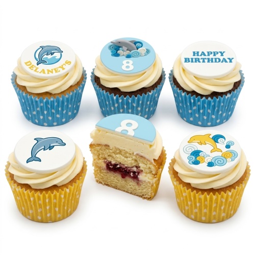 Dolphin theme birthday cupcakes with custom age and 'Happy Birthday' toppers.