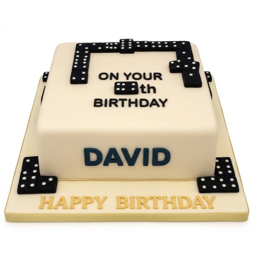 Square cream fondant cake decorated with black domino tiles, featuring a custom age and personalised name.