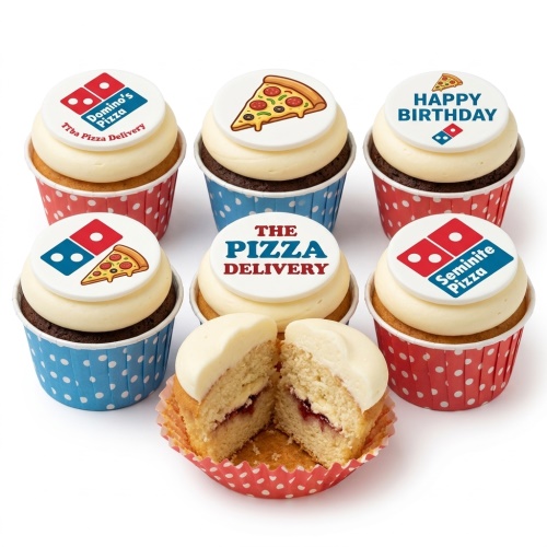 Six cupcakes with white frosting and edible pizza and Domino's-style logo toppers in red and blue polka dot cases. One cupcake is cut open showing jam filling.