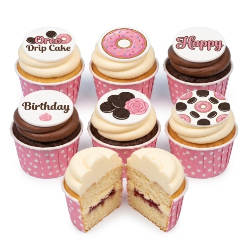 Assorted birthday cupcakes with donut and Oreo themed edible toppers and pink polka dot cases.
