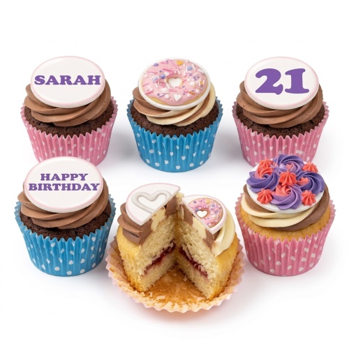 Assortment of birthday cupcakes with chocolate and vanilla frosting, topped with custom message, donut, heart, and floral designs.