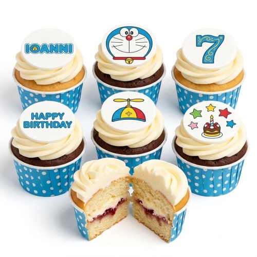 Six Doraemon themed birthday cupcakes with white frosting and blue polka dot cases, featuring Doraemon, a propeller hat, a birthday cake, and a custom age topper.