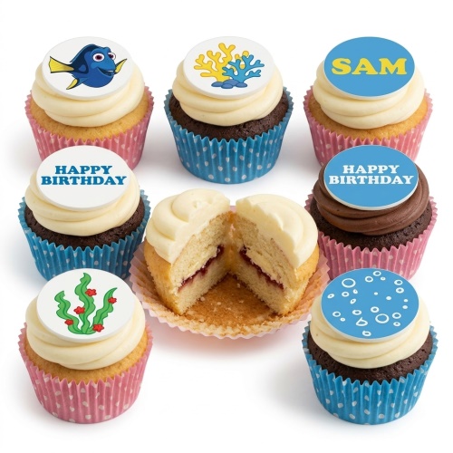 Selection of Finding Dory and Under The Sea themed cupcakes with Dory, coral, seaweed, and bubble toppers, some with 'Happy Birthday' messages.