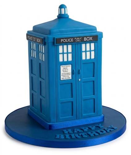 3D blue Doctor Who TARDIS police box birthday cake with a 'Happy Birthday' message on the cake board.