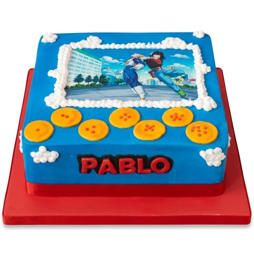 Blue square Dragon Ball Z themed birthday cake with edible character image, orange Dragon Balls, and personalised name.