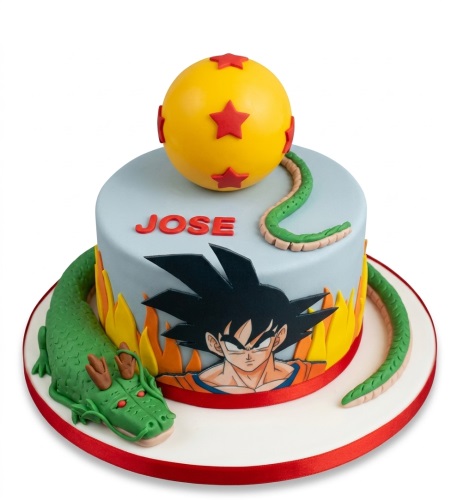 Round Dragon Ball Z birthday cake with Goku, Shenron dragon, and a yellow Dragon Ball on top.