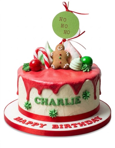 Round Christmas themed birthday cake with red drip icing, gingerbread man, candy cane, and "HO HO HO" topper.