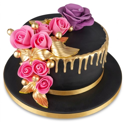Elegant black and gold birthday cake with pink and purple sugar roses, gold leaves, and a gold drip effect.