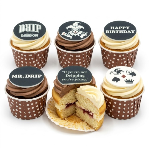 Assortment of casino theme birthday cupcakes with jester, playing card, and "Happy Birthday" toppers.