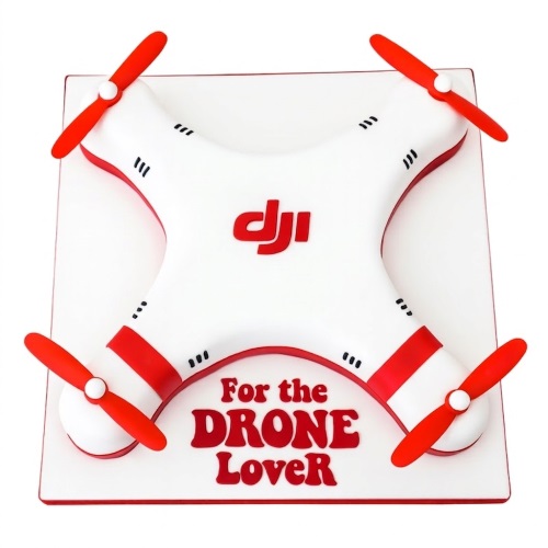 White and red drone-shaped birthday cake with DJI logo and propellers.